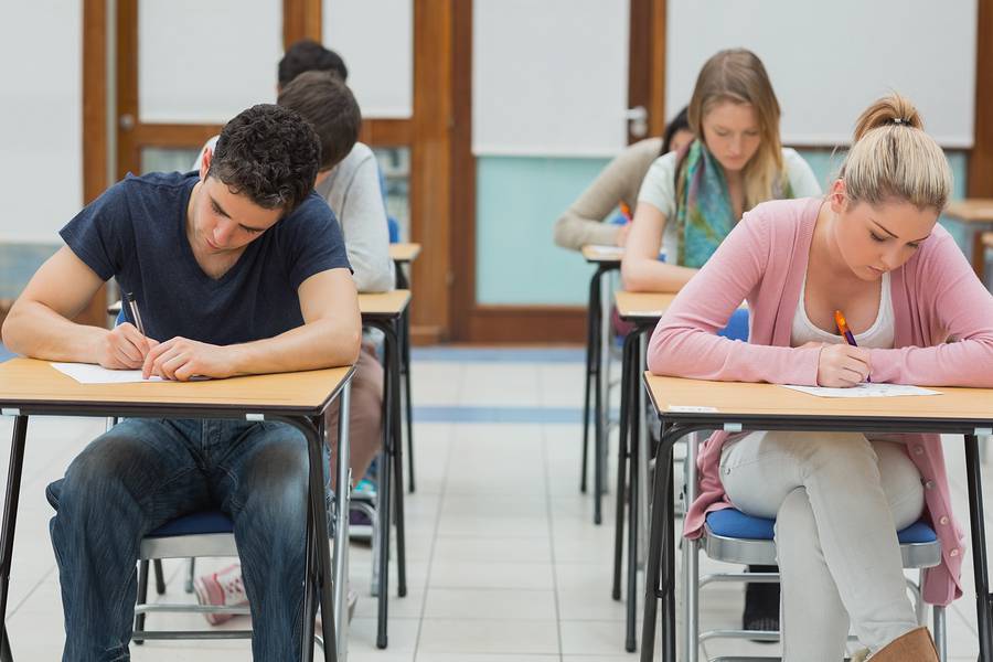 Image of student working on a teacher feddback form. | PerfectApps