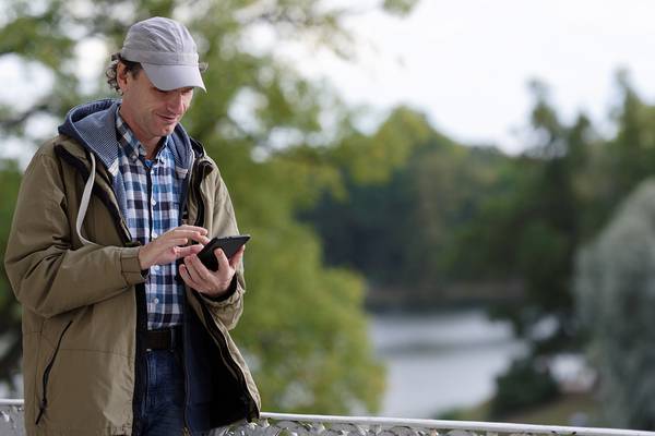 Rural outdoor man using tablet